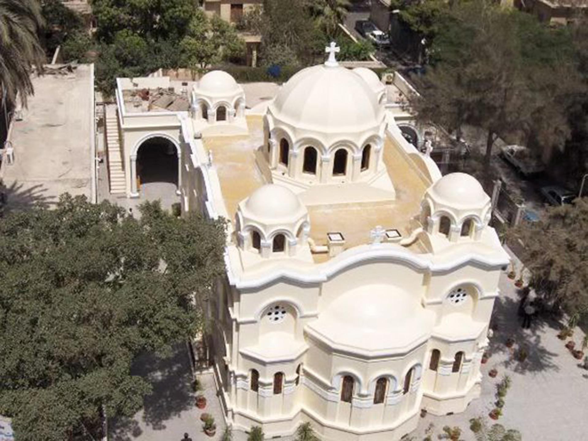 Aerial view of St. Mary’s Church, Zeitoun, today: a cream-coloured church with a large central dome and four smaller domes